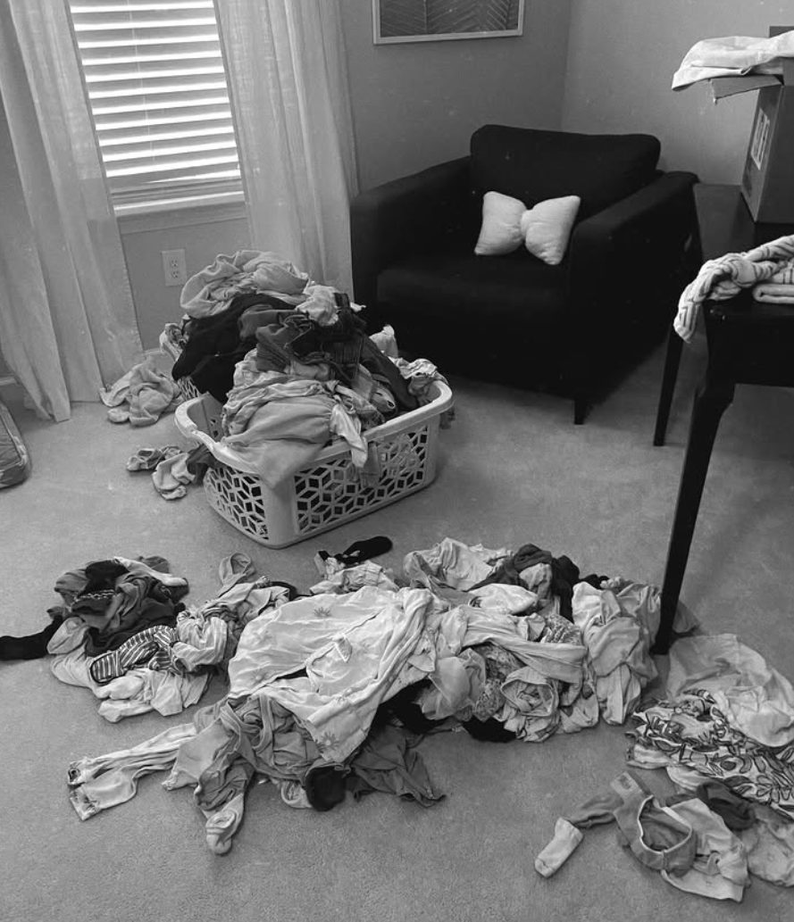 Before: a room with clothes piled on the floor and in a basket